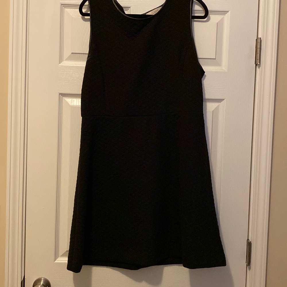 Black dress with stitching and faux leather detail